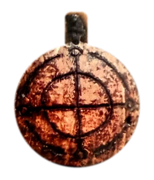 A pendant engraved with the cosmogram